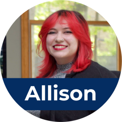 A young white woman with bright red hair sits in a chair and smiles. Across the bottom is white text in a blue rectangle that reads "Allison".