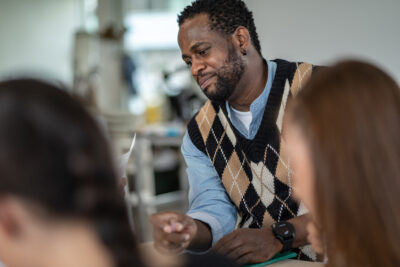 Teacher engaging with students in a classroom setting